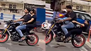 Video: बाइक पर स्टंट, सीट और टायर के बीच फंसी लड़की, लोग बोले- चोट उसे लगी, दर्द हमें हुआ