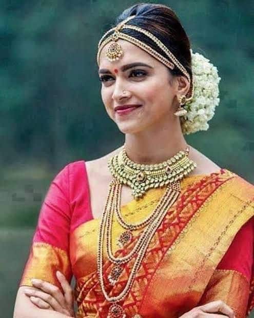 Deepika Padukone: As Meenamma in Chennai Express, Deepika embodied South Indian elegance in a traditional red saree with golden borders, making her character all the more endearing.