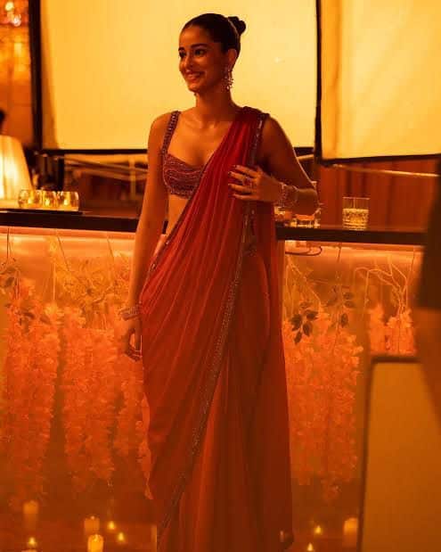 Ananya Panday : Ananya Panday blended modern chic with ethnic flair in a striking red saree paired with a detailed blouse. Her sleek bun and minimalist styling made for a clean, contemporary look that radiated sophistication.