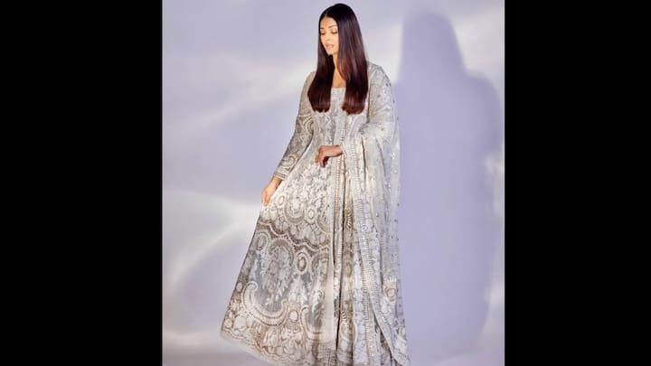 3. ⁠Dazzling Embroidered Anarkali: The actress mesmerises her fans in a heavily embroidered ivory Anarkali, radiating regal sophistication and timeless beauty. The exquisite ensemble features intricate zari work and thread embroidery that weave together floral and baroque-inspired motifs, creating a perfect balance of traditional craftsmanship and contemporary poise. The flowing silhouette, paired with a matching dupatta adorned with golden embellishments, enhances Aishwarya’s statuesque charm. (Image Source: Instagram/@aishwaryaraibachchan_arb)