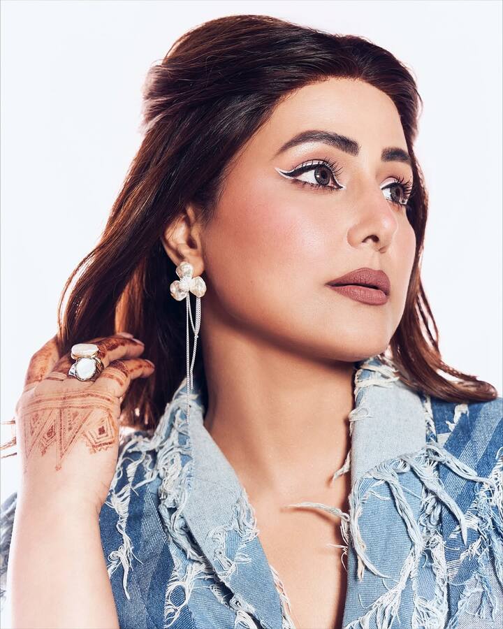 She has completed this look with matching denim heels and handbag.