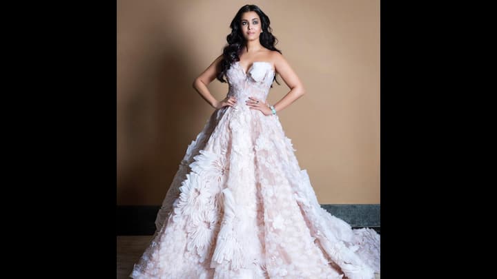 4. ⁠Floral Ball Gown: Aishwarya Rai Bachchan looked straight out of a fairytale in this breathtaking floral ball gown. The strapless couture creation featured three-dimensional floral appliqués, intricate lacework, and a voluminous silhouette, making it one of her most enchanting red carpet looks ever. The delicate play of textures and the pastel palette highlighted her innate poise and elegance, capturing the essence of modern royalty. (Image Source: Instagram/@aishwaryaraibachchan_arb)