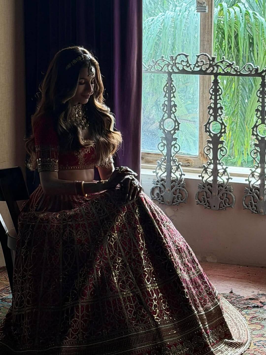Tejal Kulkarni selected a red colored lehenga for her special day. Heavy embroidery is seen throughout the outfit. Besides, its border has also been decorated with different designs.