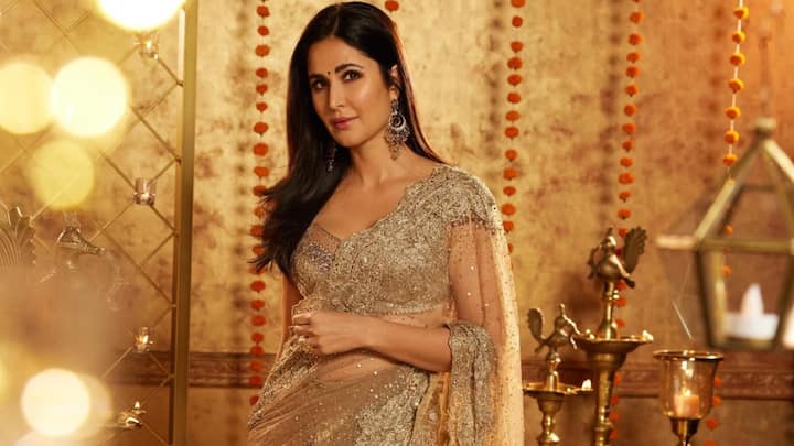 Katrina Kaif exudes divine grace in this metallic gold saree intricately detailed with embroidery and beadwork. Paired with minimal jewelry, soft waves, and dewy makeup, her look is effortlessly refined and radiantly glamorous. (Image Source: Instagram/ katrinakaif)