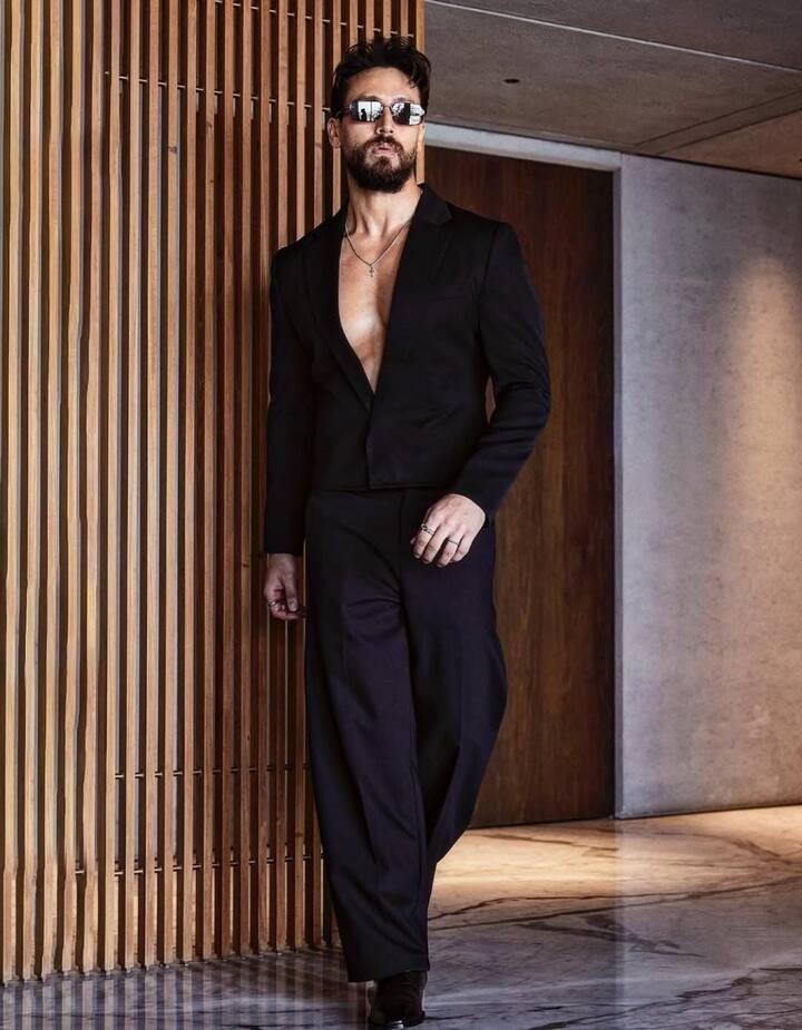 The Sleek Performer : When Tiger Shroff steps out in black, it’s precision meeting panache. Known for his sculpted frame and disciplined lifestyle, his fashion choices mirror his personality — sharp, functional, and unapologetically confident. From tailored jackets to fitted shirts, Tiger’s take on black is sleek and athletic. He doesn’t rely on flash; his poise does the talking. For him, black isn’t just fashion — it’s his armour for performance and perfection.