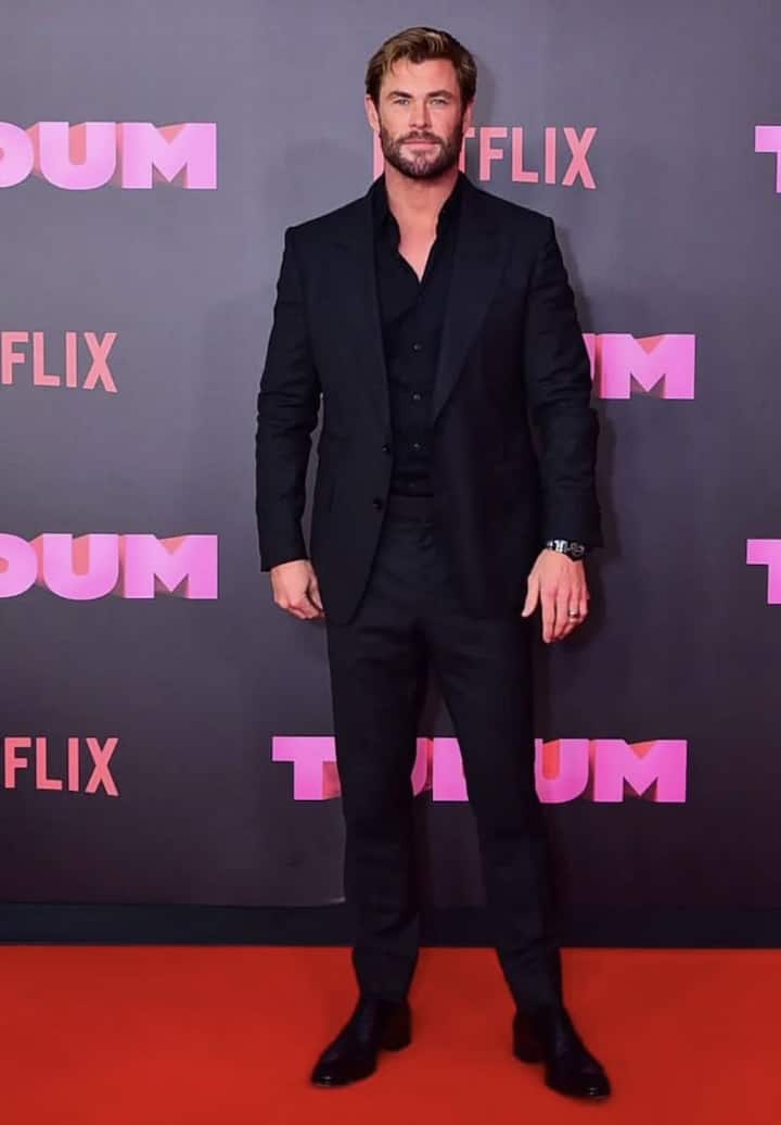 The Red-Carpet Icon : Chris Hemsworth brings a charismatic edge to classic black. His style blends traditional tailoring with modern cool — think open-collared shirts under structured blazers and perfectly cut trousers. Whether posing on the red carpet or vacationing by the sea, Chris’s take on black radiates ease and authority. He embodies what the colour has always stood for — strength, sophistication, and undeniable star power.