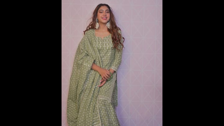4. Serene Sage Green Printed Kurta Set: Niti Taylor proves that elegance lies in simplicity as she stuns in a soft sage green ethnic ensemble. The outfit features a beautifully printed kurta paired with matching palazzos and a coordinating dupatta, creating a perfectly balanced monochrome look. The subtle silver embroidery along the neckline and borders adds a hint of shimmer, making it ideal for festive mornings or daytime gatherings. Her choice of statement earrings and matching green bangles adds a traditional touch, while her softly curled hair and radiant smile elevate the charm of this minimal yet graceful outfit. (Image Source: Instagram/@nititaylor)