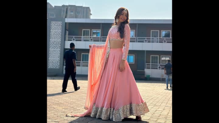 2. Pastel Pink Lehenga: Niti Taylor looks nothing short of ethereal in this stunning pastel pink lehenga that perfectly blends modern grace with traditional allure. The outfit features a delicately embroidered blouse with intricate mirror and threadwork, paired with a flowing silk skirt highlighted by an embellished silver border that adds the perfect festive sparkle. The sheer dupatta with shimmering detailing completes the look, giving it a soft, romantic charm that’s ideal for weddings, receptions, or festive soirées. Niti accessorises the ensemble with statement jewellery, including a gorgeous maang tikka and chandbalis. This dreamy pastel outfit is a flawless choice for bridesmaids or anyone looking to make an elegant style statement this season. (Image Source: Instagram/@nititaylor)