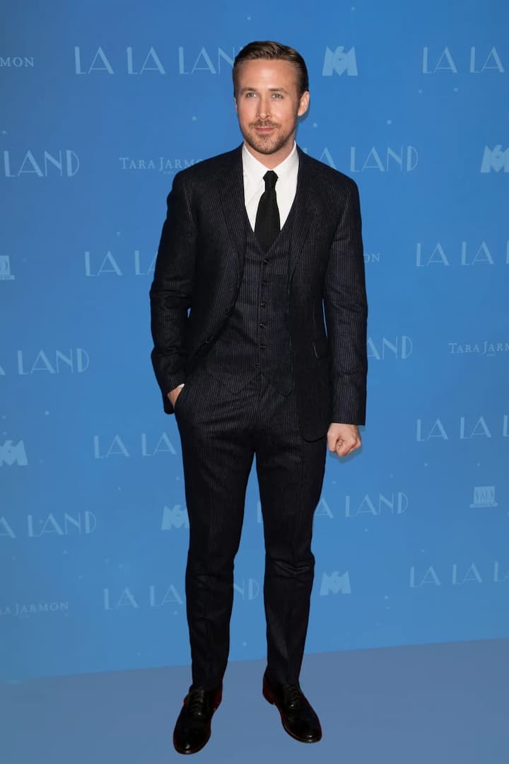 The Refined Romantic : Ryan Gosling brings timeless grace to black. His aesthetic is rooted in subtle sophistication — perfectly cut suits, clean lines, and fabrics that move with quiet luxury. Whether in a tuxedo or a soft-knit pullover, Ryan’s charm lies in restraint. His version of black isn’t loud — it’s magnetic, proving that elegance often speaks in whispers.