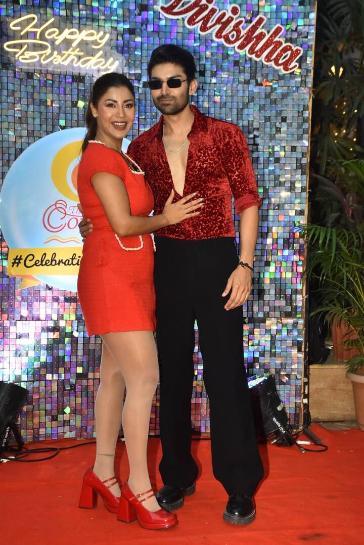 The glamorous look of Gurmeet and Debina was seen on their daughter's birthday. Gurmeet wore red shirt and black pants. Debina was seen in a red colored short dress.