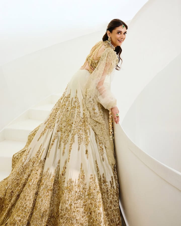 Talking about the look of the actress, she is wearing a very beautiful heavy work white and golden combination lehenga.