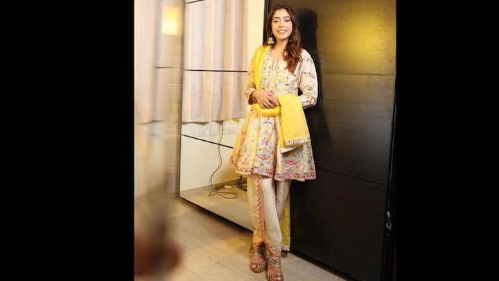 3. Cream And Yellow Embroidered Kurta Set: Niti Taylor lights up the room in this elegant cream-hued kurta set that perfectly captures festive grace with a touch of sunshine. The outfit features intricate multicoloured embroidery that adds vibrancy to the subtle base, paired beautifully with cream trousers detailed with delicate threadwork along the hem. The look is elevated with a bright yellow dupatta, infusing the ensemble with warmth and a festive glow. Niti’s effortless charm and poised elegance make this look a true inspiration for those who love minimal yet lively traditional wear.(Image Source: Instagram/@nititaylor)