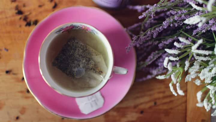 Lavender Tea – Calm in a Cup: Lavender tea is known for its serene floral aroma and relaxing properties. It reduces anxiety, aids sleep, and relieves headaches. A warm lavender infusion before bedtime can help you unwind and drift into a peaceful slumber, your perfect nighttime companion. (Image Source: Canva)