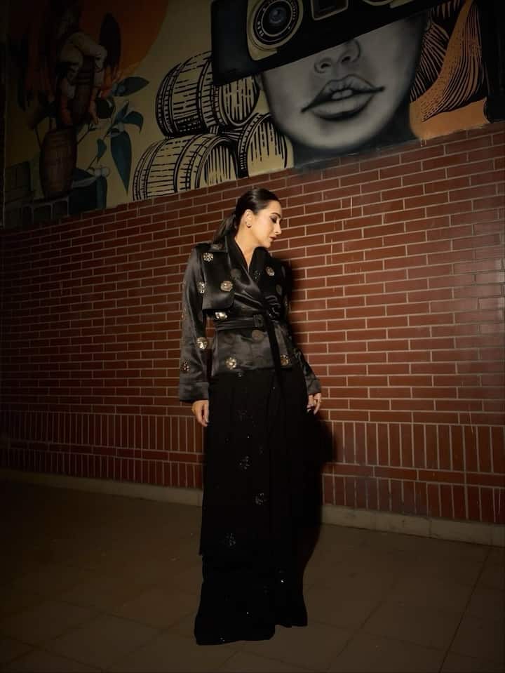 Karisma Kapoor continues to prove that elegance never goes out of style. The timeless beauty recently turned heads with her chic black ensemble that perfectly blended traditional charm with modern sophistication.