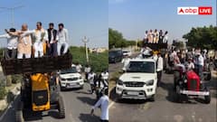 राजस्थान: कांग्रेस नेताओं ने उड़ाई नियमों की धज्जियां, JCB पर खड़े होकर किया धरना प्रदर्शन