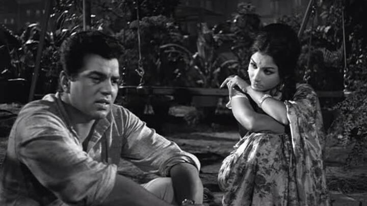 4. Anupama: In Anupama, Dharmendra shed his tough exterior to portray the gentle and introspective writer, Ashok. This romantic drama directed by Hrishikesh Mukherjee brought out Dharmendra’s sensitive, poetic side. With restrained dialogue delivery and expressive eyes, Dharmendra conveyed empathy and patience with remarkable grace. He wasn’t the conventional hero here, no grand gestures or loud declarations, just quiet understanding and emotional depth. His nuanced performance in Anupama established him as one of the finest actors of his generation, capable of expressing love and compassion with simplicity. The film remains a shining example of how Dharmendra could balance strength with softness effortlessly. (Image Source: Pinterest/tariqmasaud)