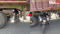 ट्रैफिक में चालू ट्रक के नीचे से निकल गया शख्स! यूजर्स बोले, भाई यमराज का भतीजा है क्या? वीडियो वायरल