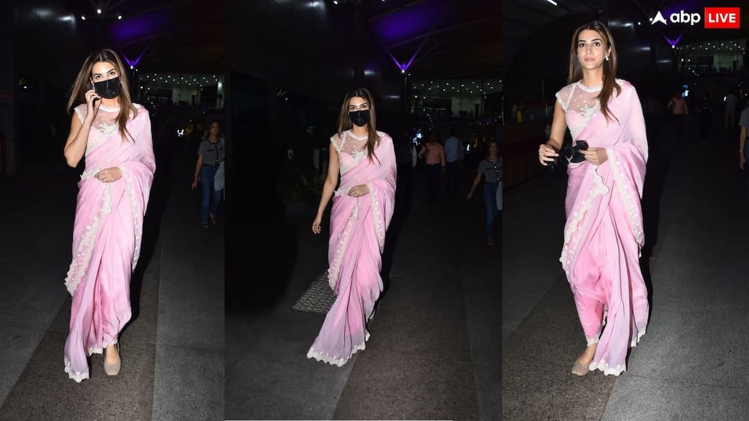 पिंक साड़ी में ब्लैक मास्क लगाए एयरपोर्ट पर स्पॉट हुईं कृति सेनन, फोटोज हुई वायरल