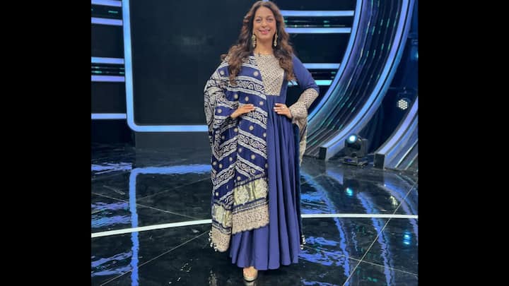 8. Navy Blue Embroidered Anarkali Ensemble: Juhi Chawla looks absolutely regal in this stunning navy blue Anarkali outfit that beautifully blends grace and grandeur. The floor-length ensemble features intricate silver embroidery across the bodice, complemented by a richly patterned dupatta that adds a luxurious touch. The heavy ethnic detailing and flowy silhouette enhance Juhi’s timeless charm, while the full sleeves and flared hemline lend a classic finish. This elegant attire is an ideal inspiration for festive gatherings, weddings, or traditional celebrations, reflecting Juhi’s effortless ability to combine tradition with sophistication. The deep blue hue paired with ornate silver accents makes this look one of her most memorable ethnic style moments. (Image Source: Instagram/@iamjuhichawla)