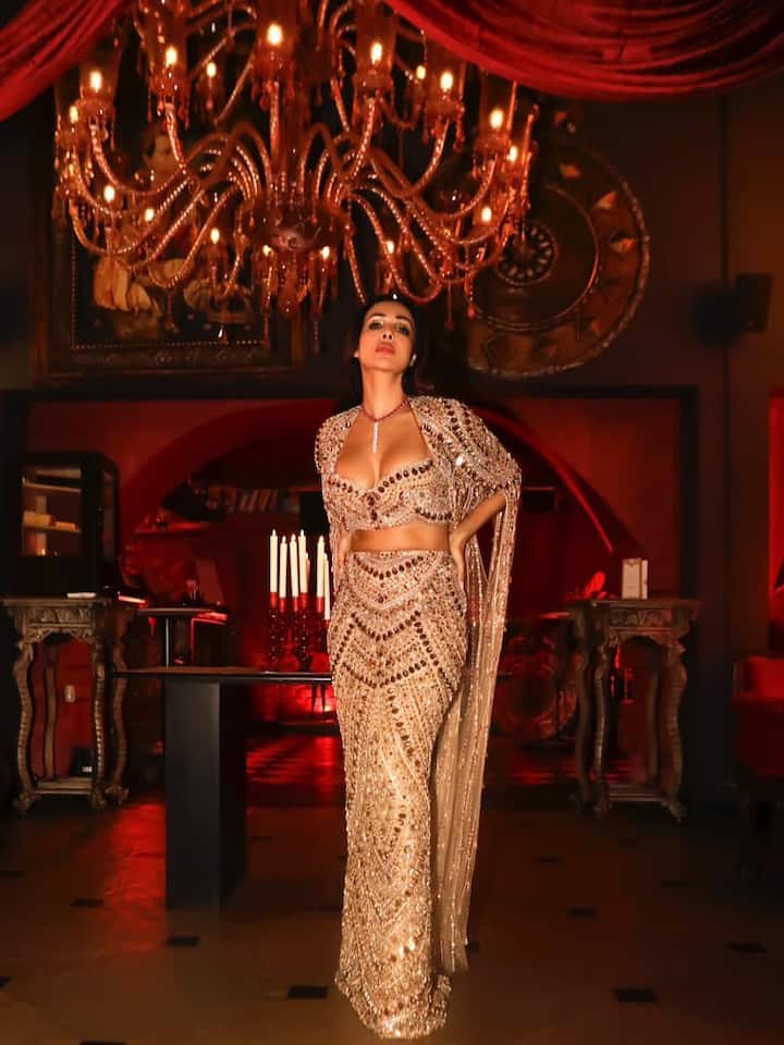 The sheer dupatta, draped gracefully over her shoulder, added a soft romantic finish to the opulent look.