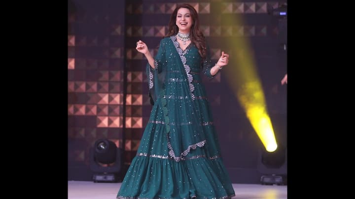 1. Radiant Bottle Green Attire: Juhi Chawla captivates hearts in this stunning bottle-green attire. The flared silhouette and scalloped detailing along the hem and dupatta add a graceful touch, while the rich green hue enhances her timeless charm. She completes the look with a dazzling statement choker. Juhi’s ensemble strikes the perfect balance between elegance and vibrancy, making it a must-see look for anyone seeking ethnic fashion inspiration. (Image Source: Instagram/@iamjuhichawla)