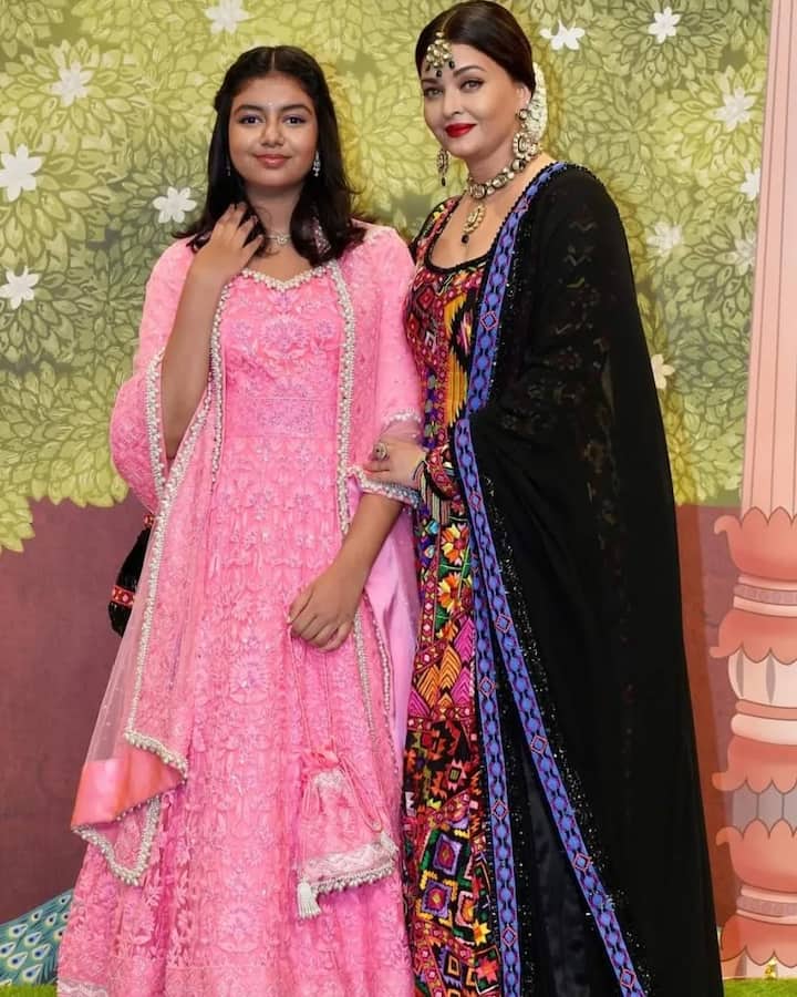Aaradhya is looking very beautiful wearing a pink colored gown. Matching earrings and open hair are adding to her beauty.