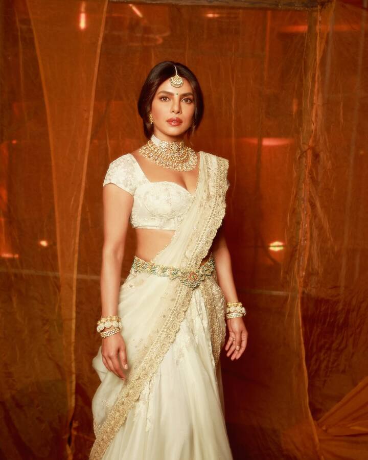 She wore a matching blouse and draped the dupatta in pleated style.