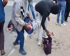 અમદાવાદમાં દારૂબંધીના ધજાગરા: પોલીસની નજર સામે જ મહિલા બુટલેગરોએ રસ્તા પર ફેંક્યા બિયરના ટીન, જુઓ Pics