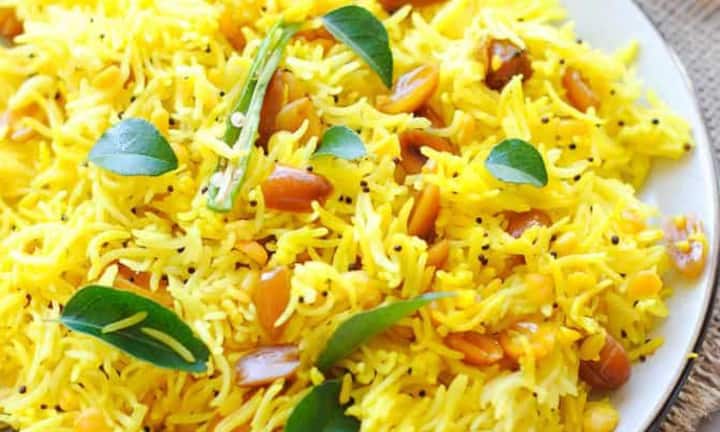 Lemon rice is made from leftover rice. It is given a sour and spicy taste by adding mustard seeds, curry leaves, turmeric, roasted peanuts and lemon juice.