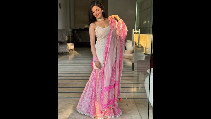 5. ⁠Soft White And Pink Suit Set: Divya Khosla Kumar embraces soft elegance in this sharara suit set. This look blends timeless Indian craftsmanship with soothing pastel tones, making it a standout addition to her ethnic style diary. The outfit features a delicate ivory blouse scattered with subtle mirror and dot embroidery. The matching dupatta with intricate pink borders and mirror accents adds the perfect finishing touch, tying the pastel palette together beautifully. (Image Source: Instagram/@divyakhossla)
