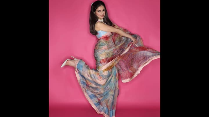 2. Pastel Floral Saree: Adding a fresh burst of colour to her ethnic wardrobe, Divya Khosla Kumar stunned in a breathtaking pastel floral saree featuring soft, watercolour-inspired prints. This look is a beautiful mix of whimsy, elegance, and summer-spring vibrancy. The saree showcases an artistic palette of powder blue, blush pink, lilac, and sunset coral. Paired with a matching sleeveless blouse, the ensemble strikes the right balance between youthful charm and classic Indian tradition. This look stands out in Divya’s ethnic fashion diary for its romantic colour story and effortless feminine appeal. (Image Source: Instagram/@divyakhossla)