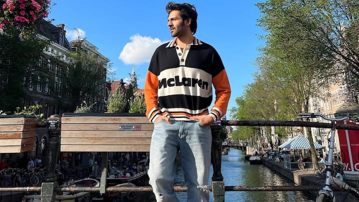 Kartik Aaryan nails sporty-casual style in this colour-blocked rugby sweatshirt paired with light-wash jeans. The black high-top sneakers ground the look, while his relaxed posture and natural hair keep it effortlessly cool. (Image Source: Instagram/ kartikaaryan)