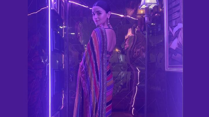 Alia Bhatt’s multicoloured striped saree brings playful vibrance to any festive occasion. Its rainbow hues and subtle shimmer create a lively yet sophisticated silhouette, making it perfect for traditional celebrations with a modern twist. (Image Source: Instagram/ aliaabhatt)