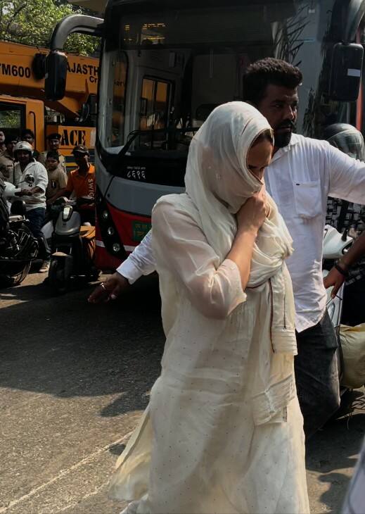 Dharmendra and Hema Malini's daughter Esha Deol was also seen in a white suit. She was seen covering her face with a scarf.