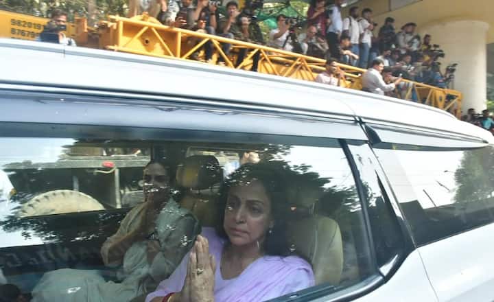 Hema Malini is seen exiting the cremation ground, requesting privacy with folded hands.