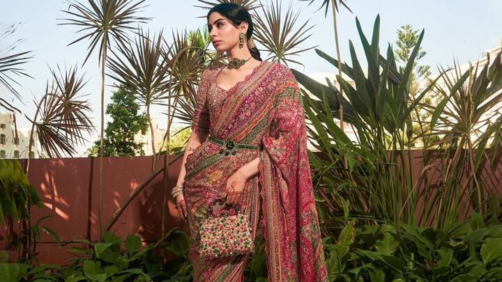 Khushi chose this vibrant Kashida-inspired saree featuring multicoloured aari and zardozi panels with floral motifs and a scalloped border. Her pink embellished blouse with tasselled sleeves added a youthful touch. Layered accessories tied the look together with effortless elegance. (Image Source: Instagram/ taruntahiliani)