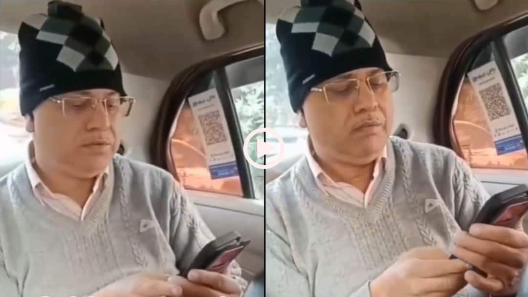 Video: कैप-स्वेटर पहन कैब में बैठा शख्स, बोला AC चलाओ, ड्राइवर से बहस का वीडियो वायरल Shocking Viral Video man wearing sweater and cap is sitting in cab and insisting driver to turn on AC Video: कैप-स्वेटर पहन कैब में बैठा शख्स, बोला AC चलाओ, ड्राइवर से बहस का वीडियो वायरल