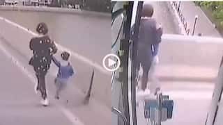 Video: बच्चे को हाथ में लिए पुल से कूद रही थी महिला, बस रोककर बचाने भागा ड्राइवर, देखें वीडियो