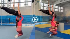 Video: ऐसा करतब नहीं देखा! हवा में उल्टा लटका शख्स... होंठों से लड़की को उठाया, हैरान कर देगा वीडियो