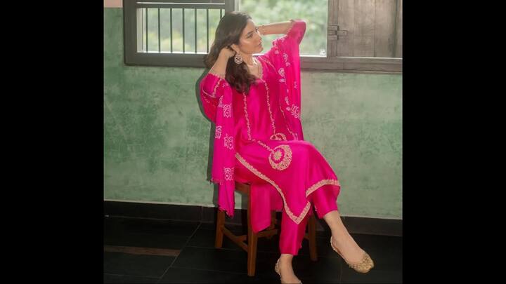 4. Vibrant Pink Embroidered Kurta: Raashii Khanna turns a simple moment into a stunning style statement with this vibrant hot-pink kurta set, radiating charm, colour and effortless elegance. The outfit instantly stands out with its rich pink hue, beautifully contrasted by delicate gold and white embroidered motifs along the neckline, sleeves, and hem. The flowy kurta paired with matching pink bottoms creates a clean, graceful silhouette, making this look perfect for casual celebrations, festive get-togethers, or elegant daytime outings. Raashii styles the ensemble with statement silver jhumkas and soft, natural makeup, letting the outfit’s bold colour take centre stage. The traditional juttis complete the outfit beautifully, grounding it in classic Indian charm while keeping the overall aesthetic chic and comfortable. (Image Source: Instagram/@raashiisheaven)