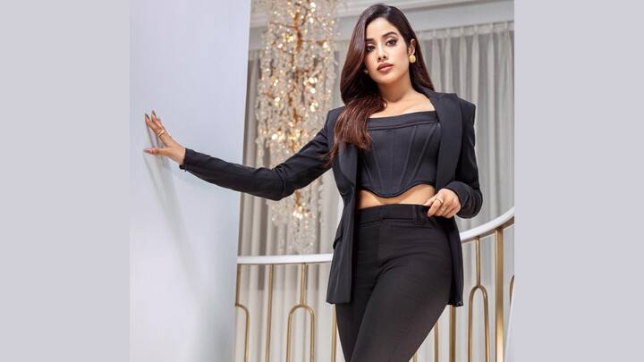 Corset-Blazer Pantsuit: Janhvi styled her blazer the sultry way by pairing it with a corset top and wide-leg pants in all black. Simple gold accessories completed the sleek monochrome look, adding just the right touch of glam. (Image Source: Instagram/ Janhvikapoor)