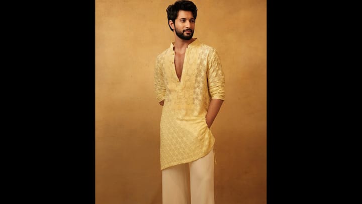 7. ⁠Pastel Yellow Kurta: Rohit Saraf brings sheer elegance to the frame in this pastel yellow embroidered kurta set, a look that perfectly blends tradition with youthful sophistication. The highlight of this ensemble is the delicately embroidered lace-textured kurta, featuring floral patterns and subtle detailing that elevate the softness of the pastel hue. The deep V-front placket adds a modern, fashion-forward edge, creating the perfect balance between ethnic charm and contemporary flair. Rohit styles the kurta with soft cream trousers, keeping the palette monochromatic and serene. The gentle colour transition makes the entire look cohesive, refined and extremely photogenic. (Image Source: Instagram/@rohitsaraf)
