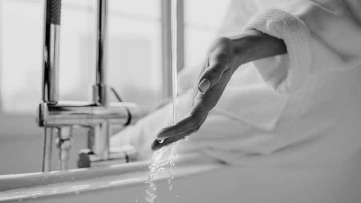 Taking Very Hot Showers: Sudden extreme temperature changes, such as coming in from cold air into a very hot shower, result in sudden dilation and constriction of the blood vessels. These fluctuations can precipitate dizziness, pressure changes, and cardiac stress that is quite unnecessary. (Image Source: Canva)