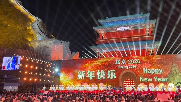 Fireworks burst over city skylines in Beijing as vibrant light displays and public celebrations usher in the New Year, with crowds gathering to mark the occasion amid colour, music and festive cheer.