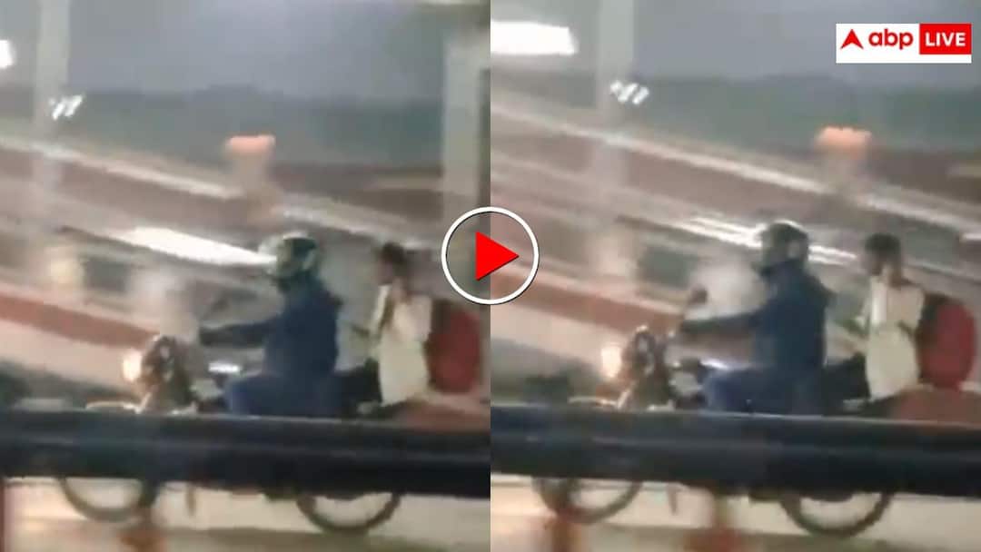 man rode his bike on platform at Gorakhpur railway station to drop off his girlfriend who was boarding train video viral छूटने लगी लड़की की ट्रेन तो शख्स ने प्लेटफॉर्म पर दौड़ा दी बाइक- वीडियो देख माथा पकड़ लेंगे आप