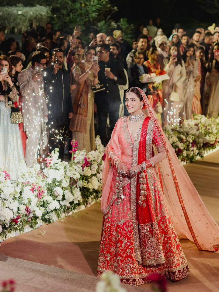 During the Christian wedding, Nupur looked radiant in a white boat-neck gown, walking down the aisle to join Stebin.