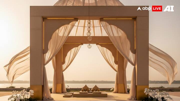 3. Serene Palace-Inspired Mandaps - Quiet Grandeur, Modern Calm: Palace-inspired mandaps in 2026 move away from heavy ornamentation toward refined, modern interpretations of royal architecture. Palatial arches, domed canopies, symmetrical layouts, and carved pillars are softened with contemporary materials, muted stone tones, flowing drapery, and subtle metallic accents. Whether set against beach horizons or heritage courtyards, these mandaps feel timeless yet light, regal without being overwhelming, grand yet serene. (Image Source: ABP Live AI)