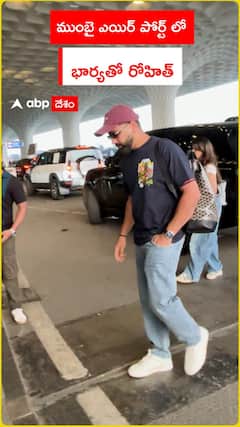 Rohit with his wife at Mumbai airport