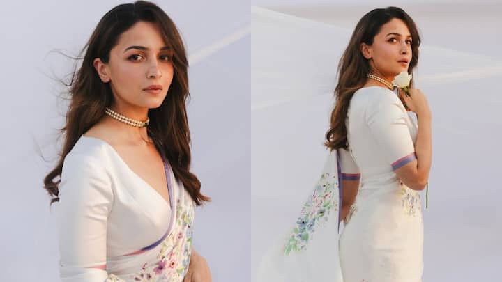 आलिया भट्ट के ब्लाउज का वी-नेक डिजाइन इसे एक मॉडर्न और ग्रेसफुल लुक देता है. इसकी बाजू लंबी हैं, जो एक स्मूथ और क्लीन फिनिश देता है. इसकी फिटिंग साड़ी के ड्रेप के साथ मिलकर क्लासिक दिखता है.