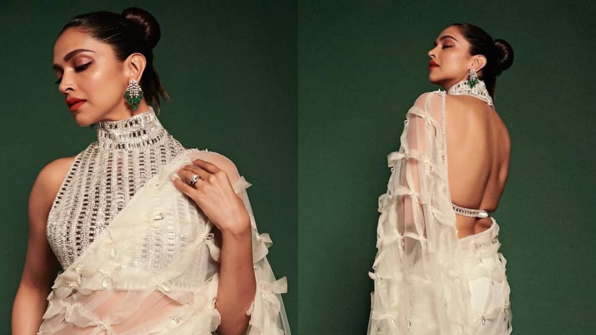 This blouse of Deepika Padukone has a high-collar with halter neck. Very intricate and jewelery work has been done on the collar, which gives it a necklace like look. This is a backless blouse, which makes it quite glamorous.